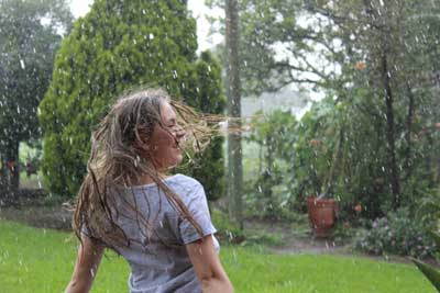 teenager in the rain